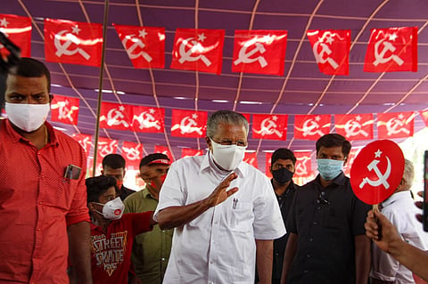 Kerala CM Pinarayi waving at supporters