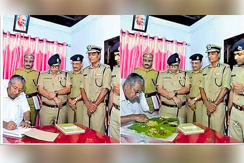 Three arrested for circulating fake photo of Kerala CM feasting at police station