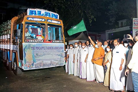 Minister Sunil Kumar flagging off pineapple truck
