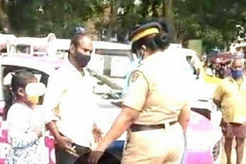 Kerala news: Visuals of the incident where a minor girl and her father who were wrongfully accused of theft in public by a pink police officer.