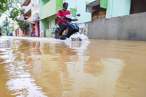 A bike crossing a flooded street