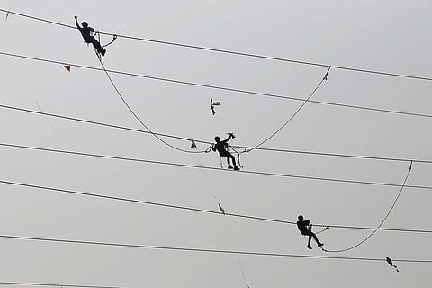 Workers handling power supply lines