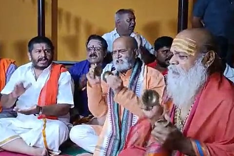 Sri Ram Sene members including Pramod Muthalik singing devotional songs at the Hanuman temple in Mysuru