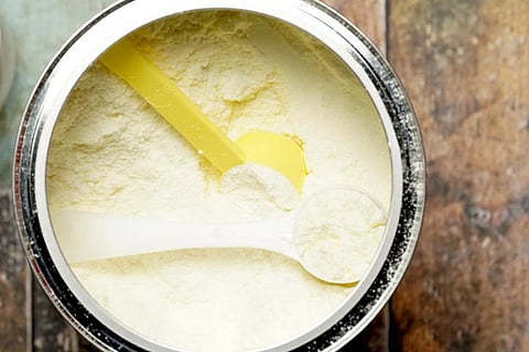 White protein powder in a container