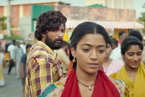 Screenshot of Allu Arjun and Rashmika from Pushpa
