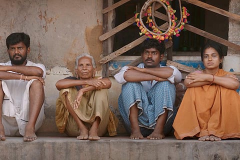 Still from Raame Aandalum Raavane Aandalum showing four characters sitting