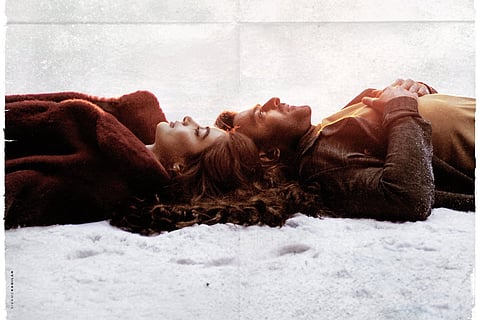 Prabhas and Pooja Hegde seen lying next to each other in the snow in the new poster for Radhe Shyam