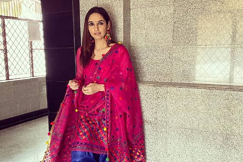 The actor is wearing a red kurta