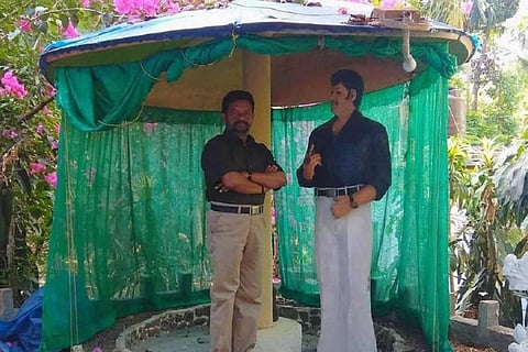 Rajan with a sculpture of Jayan