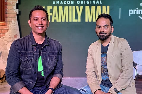 Producers Raj and DK are seen posing in the photo, while the poster of 'The Family Man' is seen in the background.