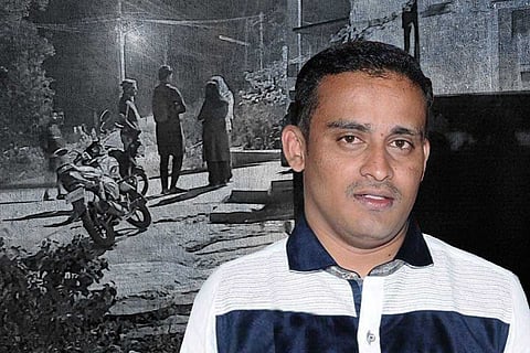 A picture of Chilume NGO director Krishnappa Ravikumar in Karnataka wearing white t-shirt