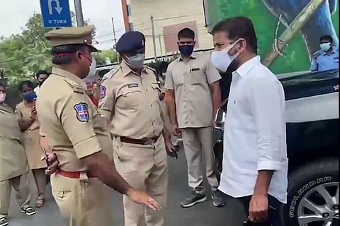 Revanth Reddy talking to police officers in Begumpet