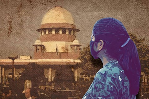 Image of a woman in front of the Supreme Court of India