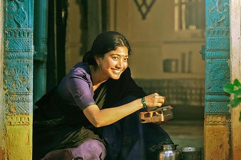 Sai Pallavi looks festive in a black and lavender half saree.