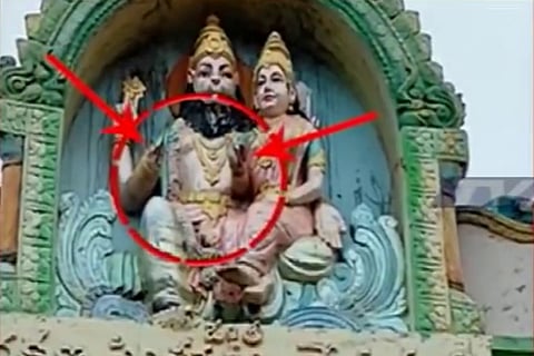 Idols of Hindu deities on an arch in an Andhra Pradesh town