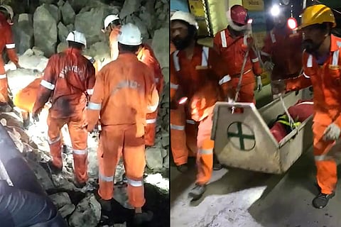 Emergecy rescue teams bringing out the body of the workers who were trapped inside the mine after the roof collapsed