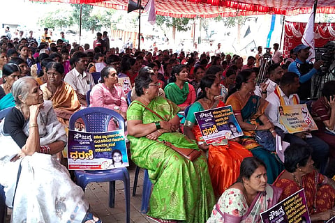 Protesters at Bengaluru holding justice for Sowjanya placards