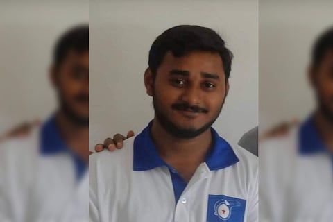 Srikanth Reddy in a white shirt posing for the photo