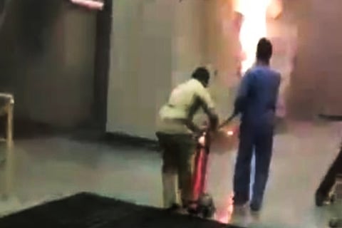 Staff trying to douse the fire