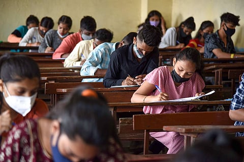 Representative image of students writing an exam