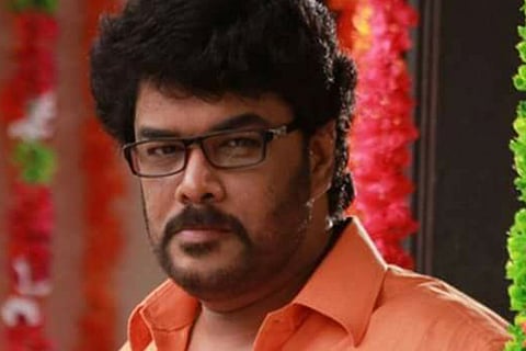 Sundar C is seen wearing an orange shirt and spectacles in the photos.