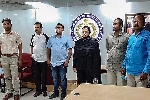 Swapna Suresh and Sandeep Nair with NIA officials
