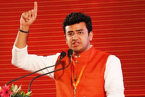 Bengaluru MP Tejasvi Surya in a saffron vest against a saffron background