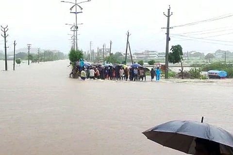 People stranded after an a reas became inundated due to heavy rains