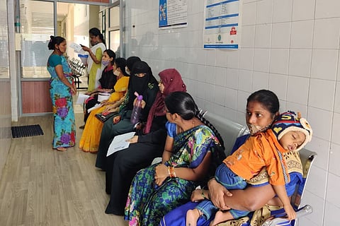 Women sitting on a furniture waiting for their turn to get the USG scan