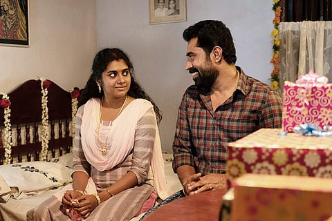 Nimisha Sajayan on the left and Suraj Venjaramoodu on the right in a screengrab from the movie 'The Great Indian Kitchen'.