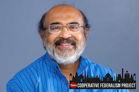 Kerala Finance Minister Thomas Isaac wearing a blue kurta smiling