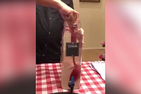 A man demonstrates how to make toddy at home.