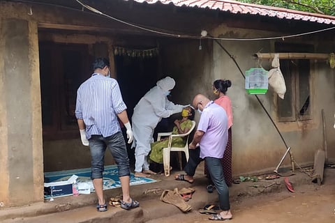 Test for novel coronavirus being conducted by a team of medical professionals in Attapadi