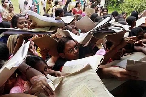 Representative image of youngsters rushing with their files