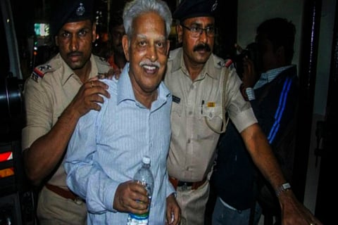 Varavara Rao being accompanied by cops