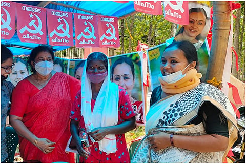 Kerala CPI (M) Candidate Veena George, wearing neck collar and mask, seeking votes