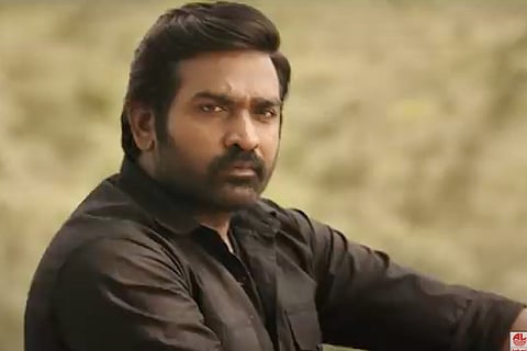 A file photo of Vijay Sethupathi wearing a black shirt and looking in the distance