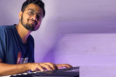 Vinesh with his piano