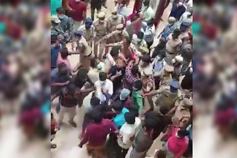 An agitated crowd barging into the hospital overpowering police