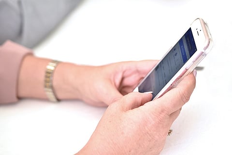 Woman using iPhone