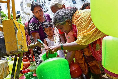 Women filling water in pots