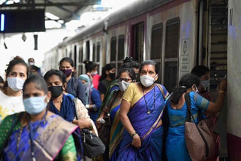 Women passengers taking a train