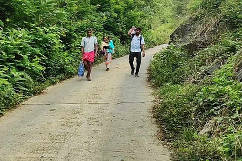 Tribespeople walking on the newly constructed road