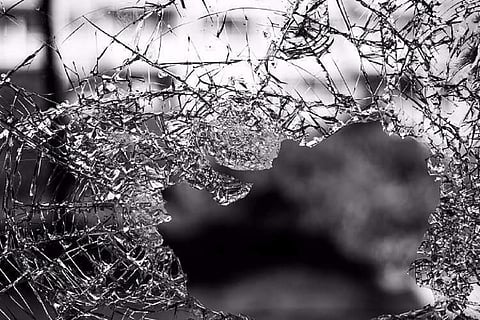 Glass of vehicle broken and cracked