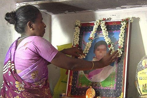 Mother of Ariyalur minor garlanding her photo