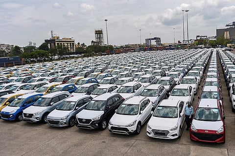 Cars lined up in the filed