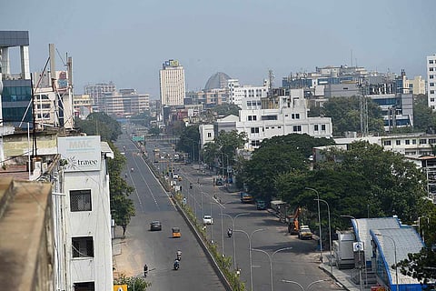 Major road in Chennai with buildings on either side