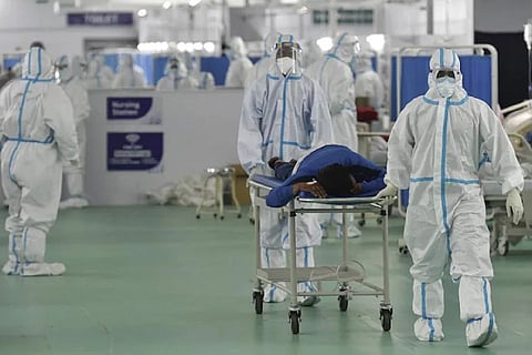 Doctors taking a coronavirus patient to a ward