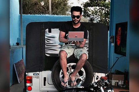 Ajith Thankachan who runs the Chrome Mental 500 page on Instagram seen sitting on a jeep here