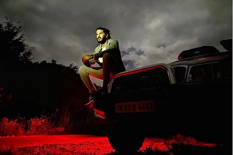 Dulquer Salmaan on a car